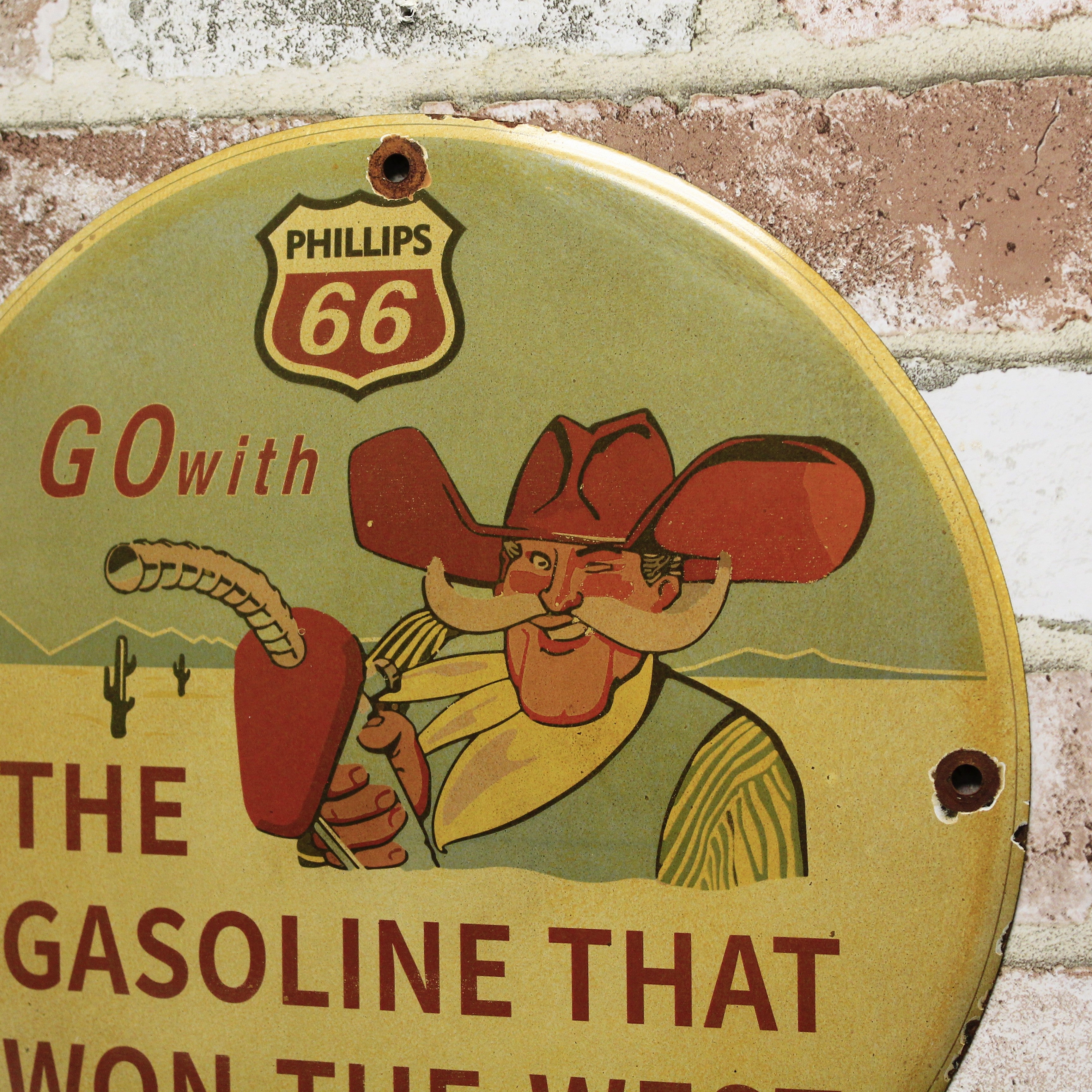 Phillips 66 Cowboy Gas That Won the West Vintage Porcelain Enamel Sign (12in)