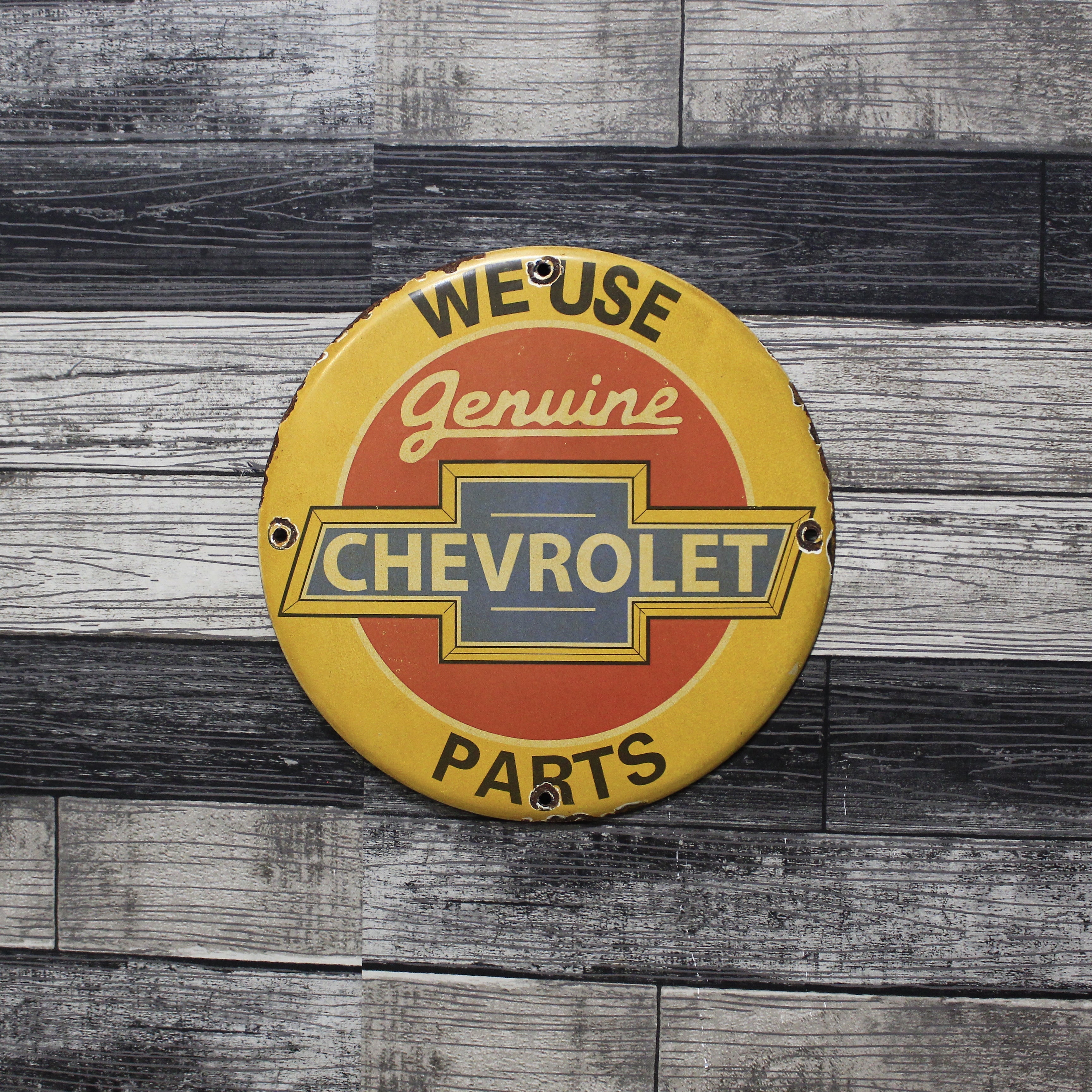 We Use Chevrolet Parts Porcelain Enamel Sign (12in)