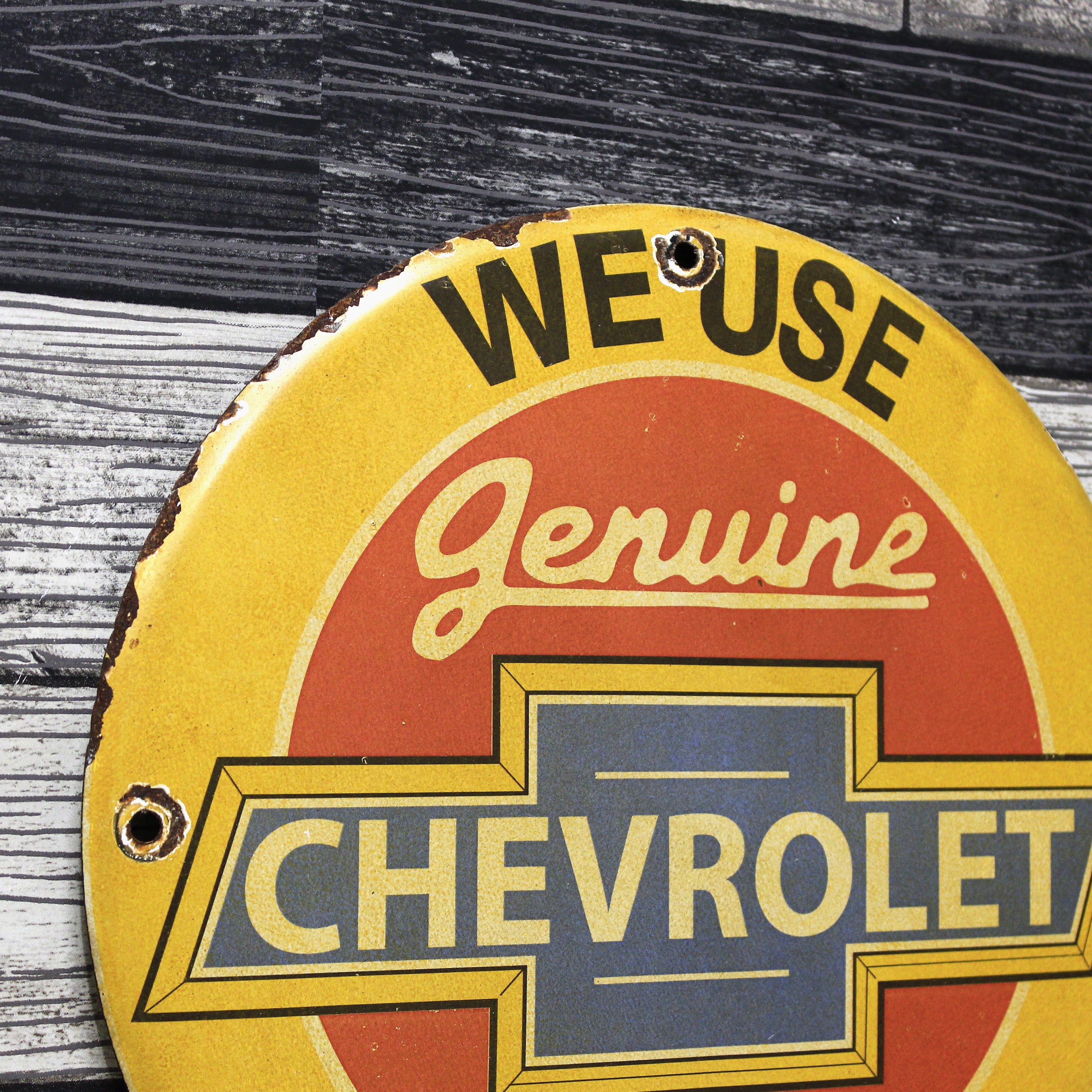 We Use Chevrolet Parts Porcelain Enamel Sign (12in)