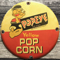 Yellow Pop Corn Popeye Brand Porcelain Enamel Sign (12in)