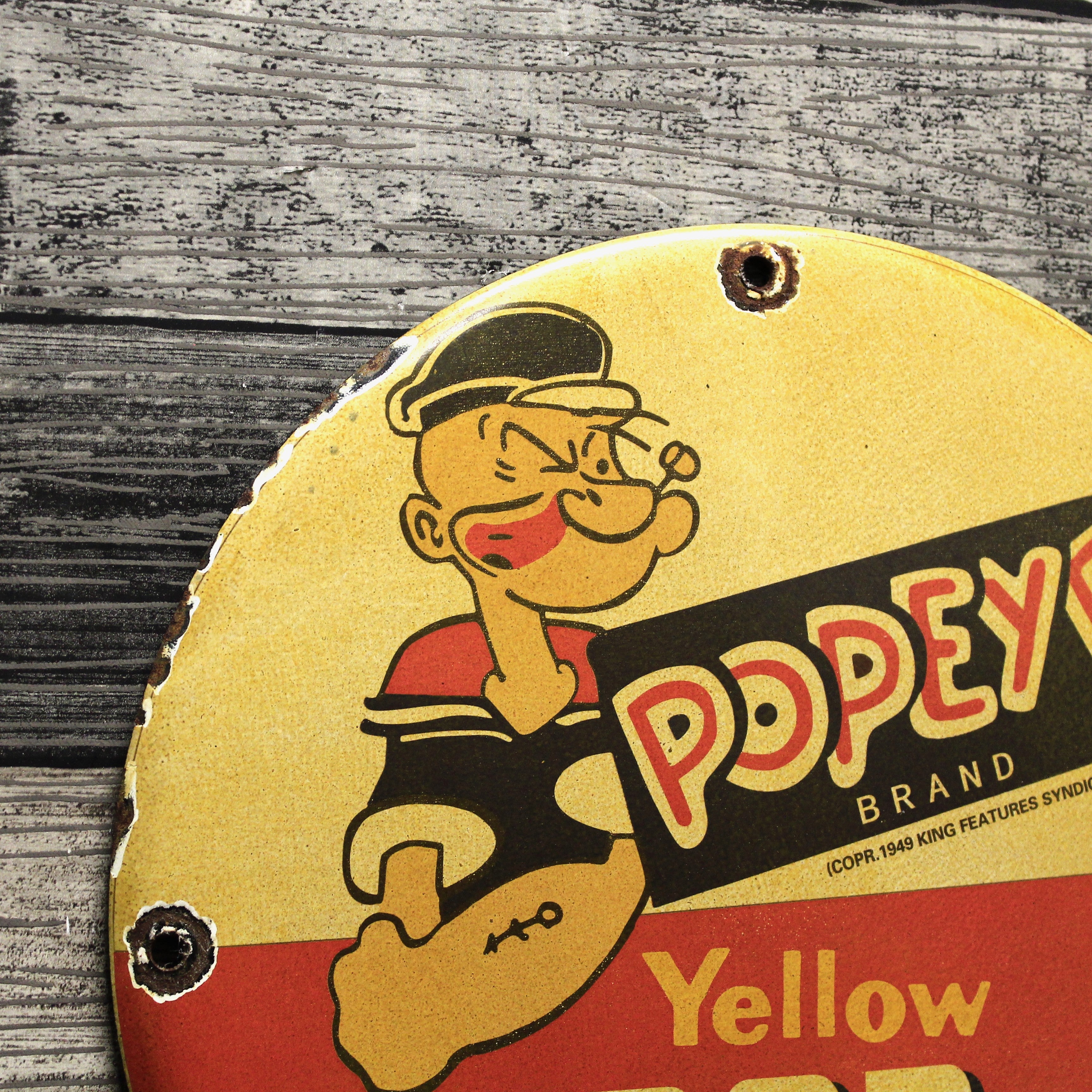 Yellow Pop Corn Popeye Brand Porcelain Enamel Sign (12in)