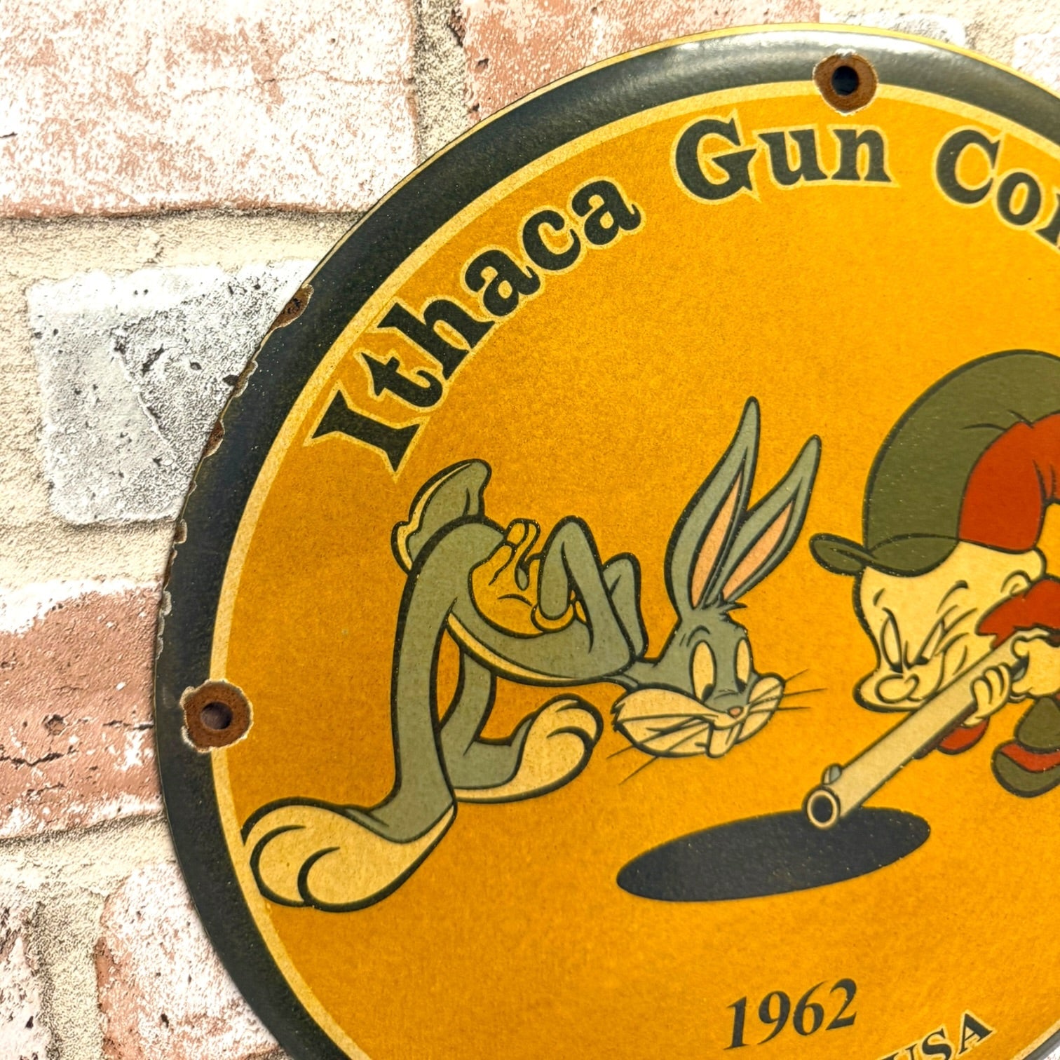 Ithaca Gun Company Porcelain Sign with Nostalgic Elmer Fudd + Bugs Bunny Vintage Advertisement